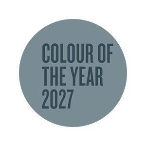 Circular graphic featuring the Valspar Color of the Year 2027 designation in Cottage Door blue-gray tones.